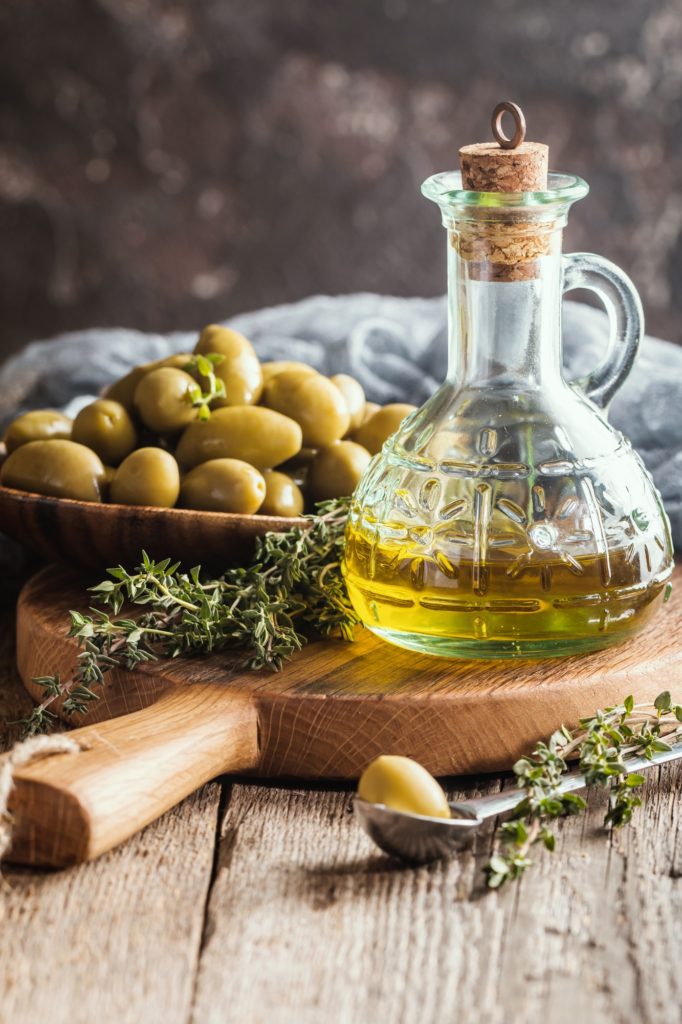 Olive oil and bowl of olives